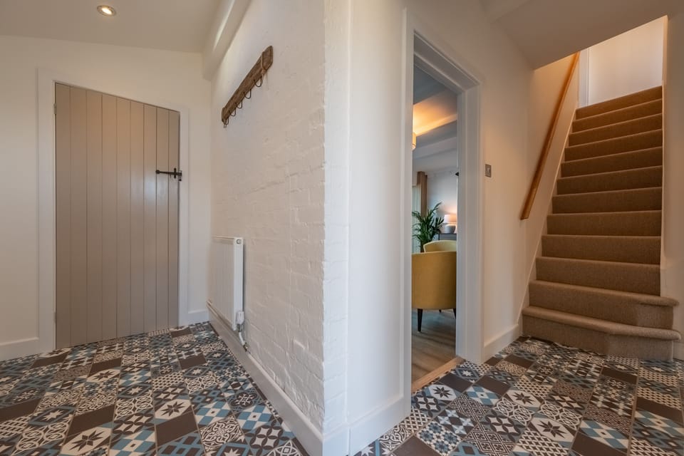 Ground floor: Entrance hall with utility cupboard with washing machine