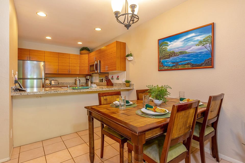 Open concept from kitchen to dining area~ with seating for four.