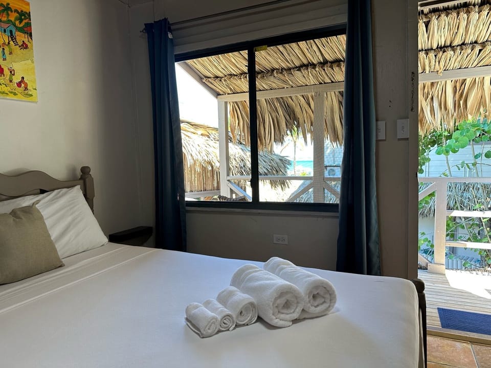 Basic Room, 1 Queen Bed, Refrigerator, Partial Sea View | Hypo-allergenic bedding, minibar, individually decorated