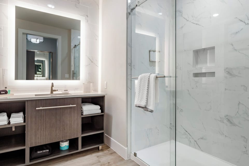 Standard Room, Multiple Beds, Non Smoking | Bathroom | Shower, rainfall showerhead, free toiletries, hair dryer