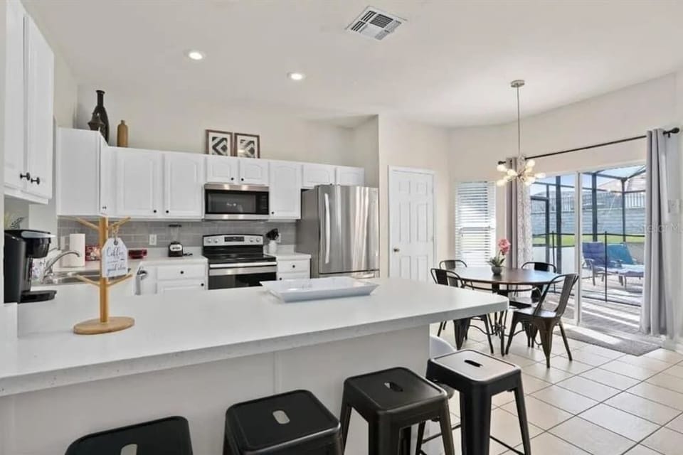Beautifully updated kitchen and fully stocked with pots & pans for easy in home meals with the family.