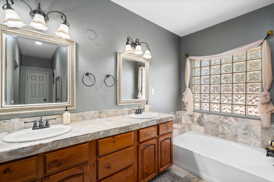 Private ensuite bathroom, tiled walk in shower, soaking bathtub, double sinks