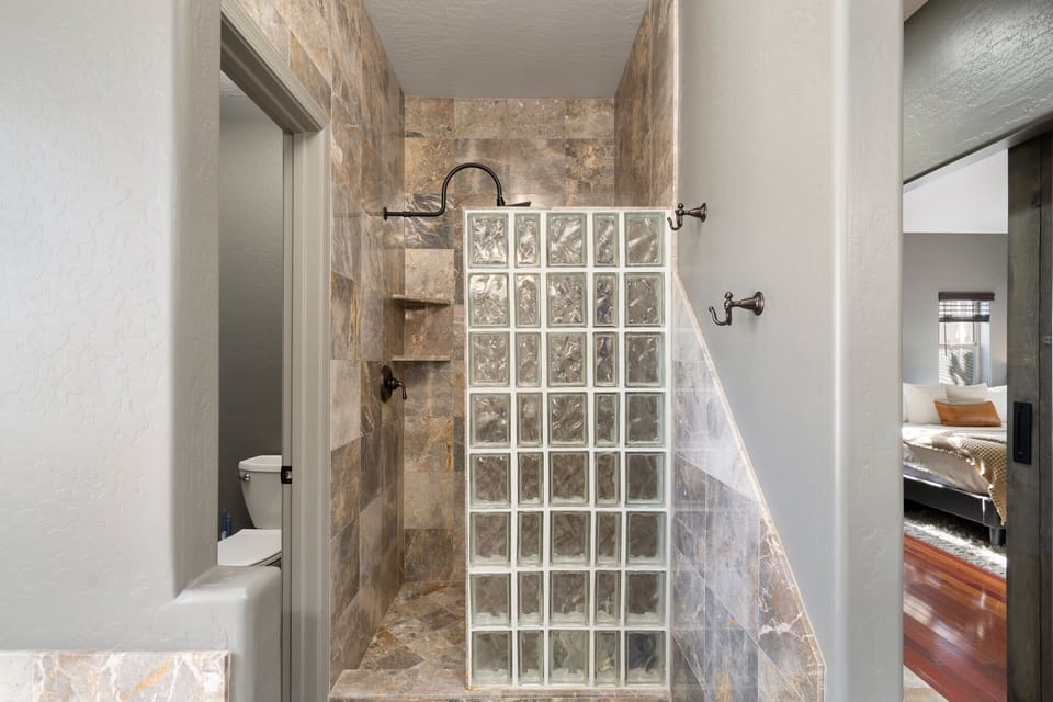 Private ensuite bathroom, tiled walk in shower, soaking bathtub, double sinks
