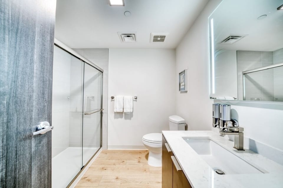 Contemporary bathroom. Walk-in shower & single vessels sink. Anti fog mirror. 