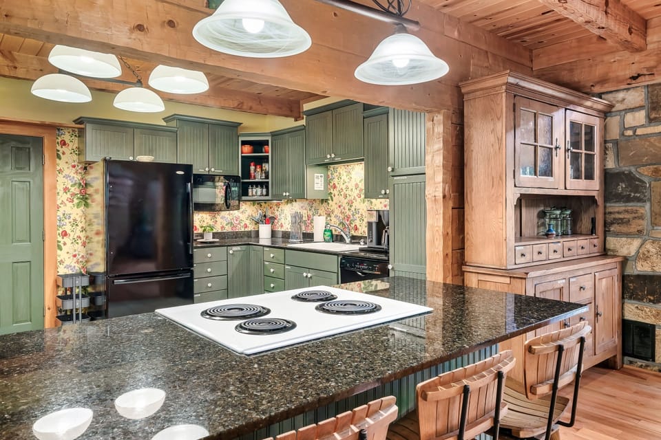The kitchen features full size appliances (fridge, dishwasher, stove/oven, microwave) and all the essentials, including a toaster, crock-pot, blender, mixer, plenty of pots, pans, and more - everything you need to feel right at home and keep everyone feed!