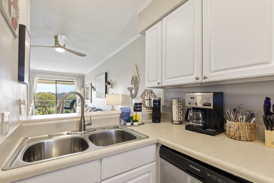 Starter items such as dish soap, detergent, paper towels, and sponges are provided