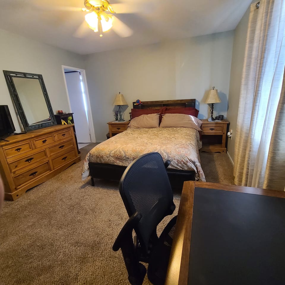 queen bed with on suite bathroom