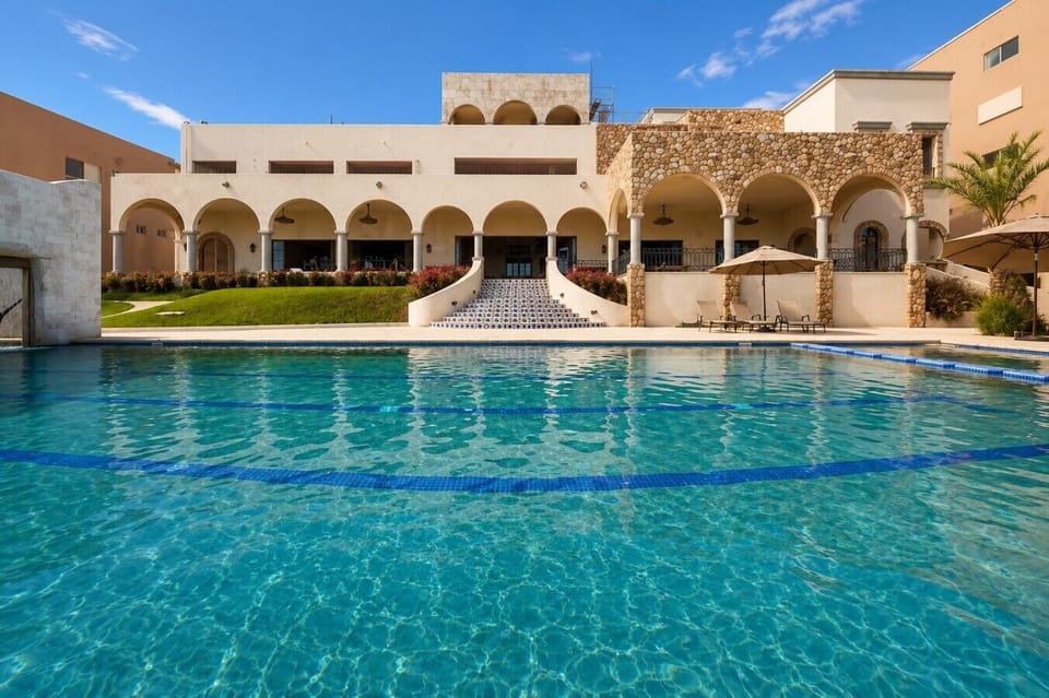 Relax by the poolside in the peaceful outdoor lounge area.