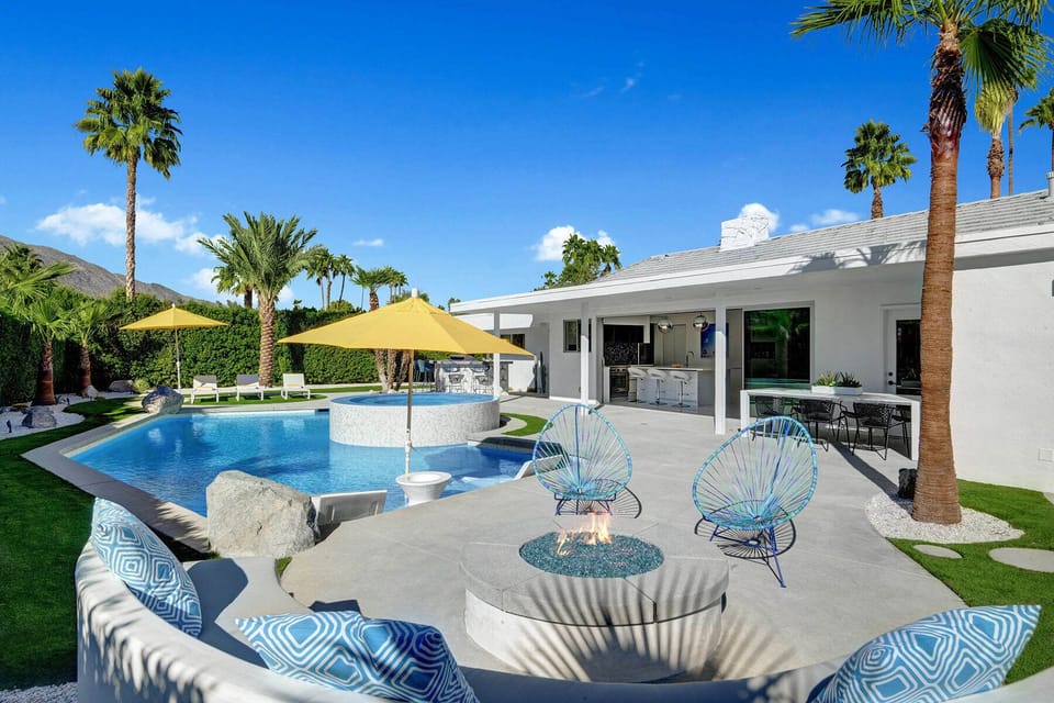 Swim in the pool by day and see it lit up like a jewel at night from the custom bench and fire pit.