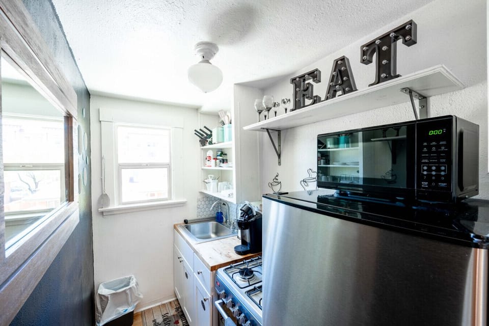 Kitchen: Bright and airy with modern appliances and charming decor – perfect for culinary adventures!
