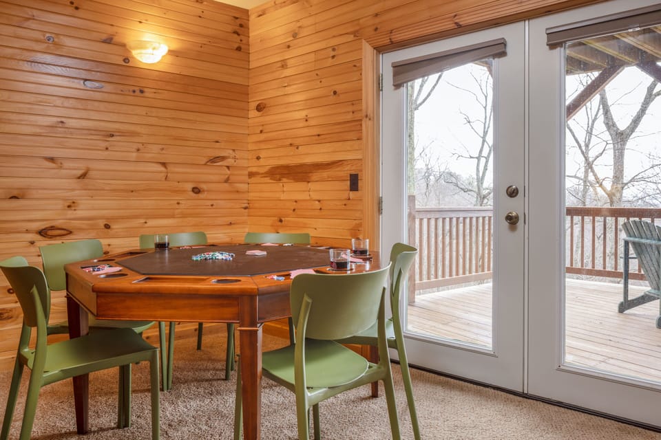 Card table near the deck entrance in the recreation room.