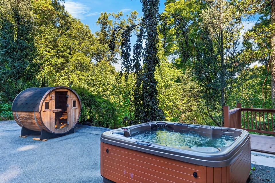 Unwind in the hot tub after a session in the cedar sauna, surrounded by secluded woods.