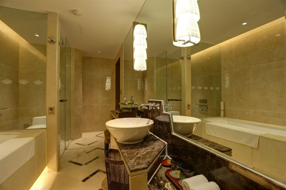 Separate tub and shower, rainfall showerhead, designer toiletries