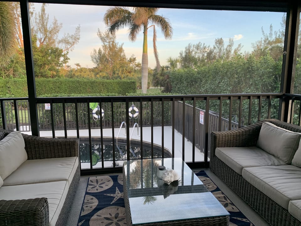 Screened patio overlooking private pool and back yard.