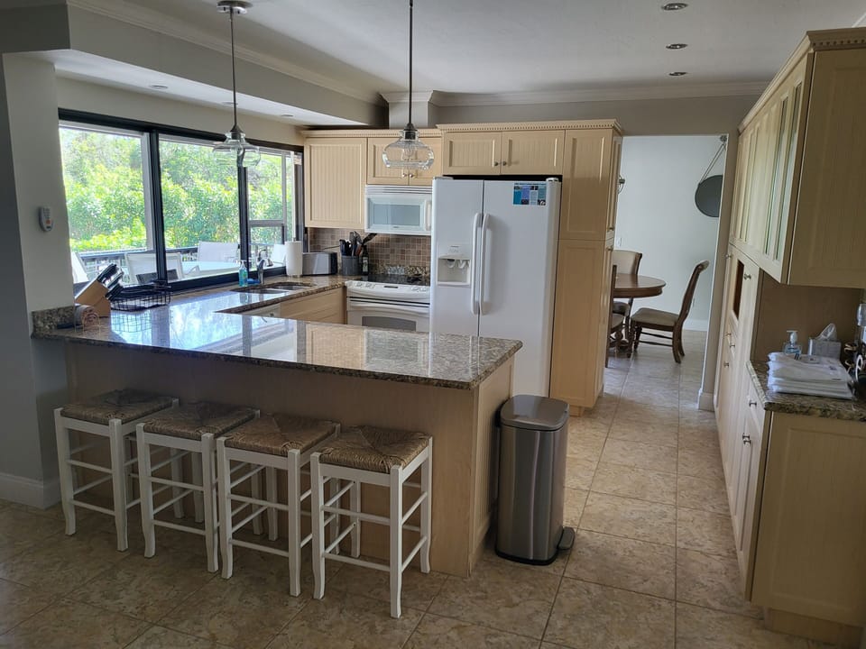 Large open kitchen with counter seating
