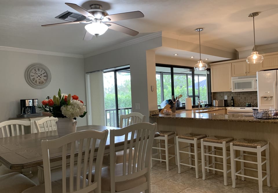 Large open kitchen with coffee area and large table.