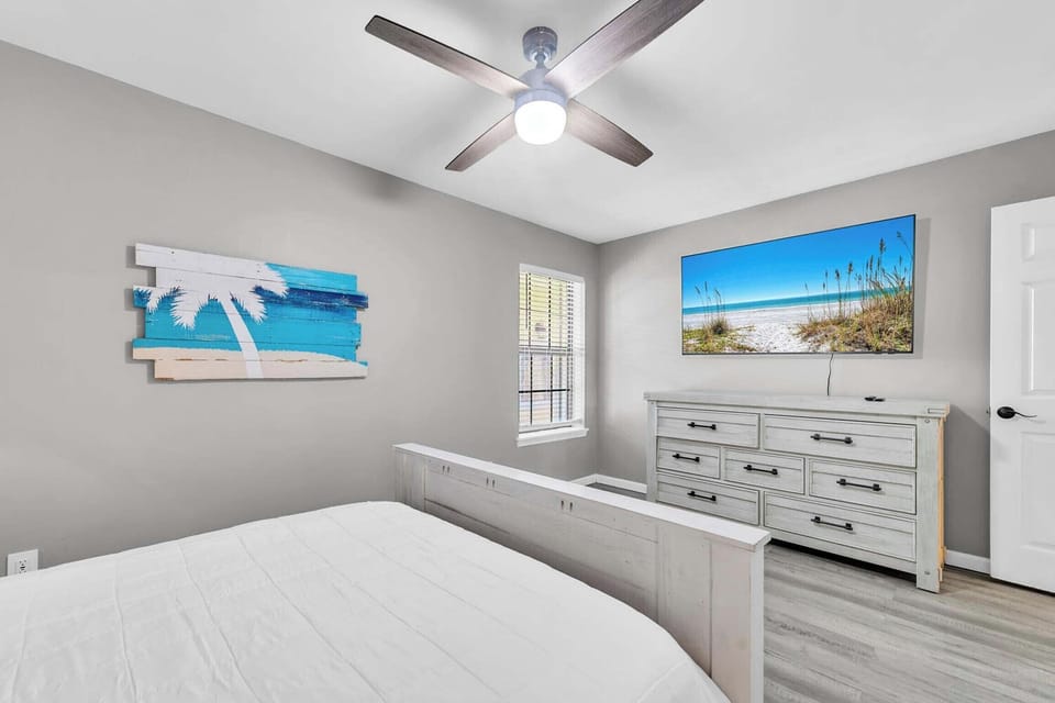 Guest bedroom with large flat-screen TV
