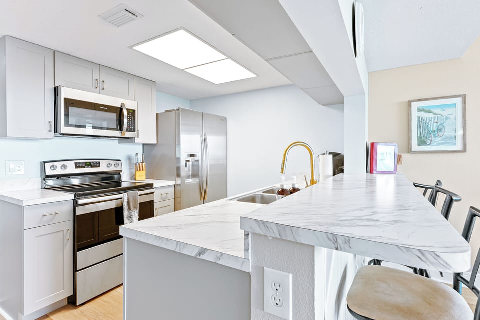 Sleek & modern kitchen with a breakfast bar