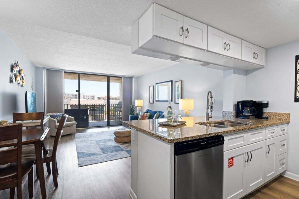 Cook, dine & unwind in this bright, open kitchen! Sleek, modern, & steps away from ocean-view relaxation