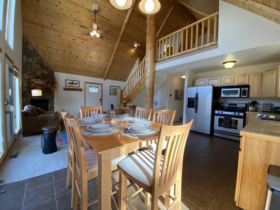 Settle in for meal time or a good board game around the high top dining table