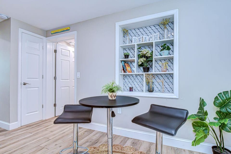 Enjoy breakfast or a glass of wine at this cheerful nook with coastal accents and built-in shelving.