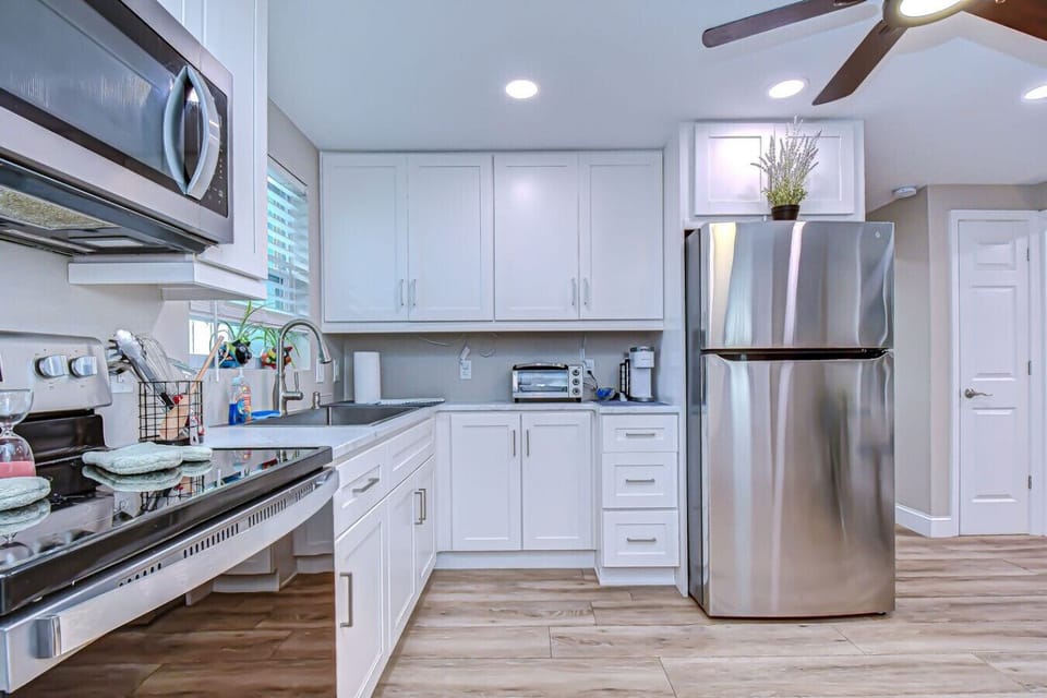 Modern stainless-steel appliances and sleek cabinetry make cooking at home a breeze.