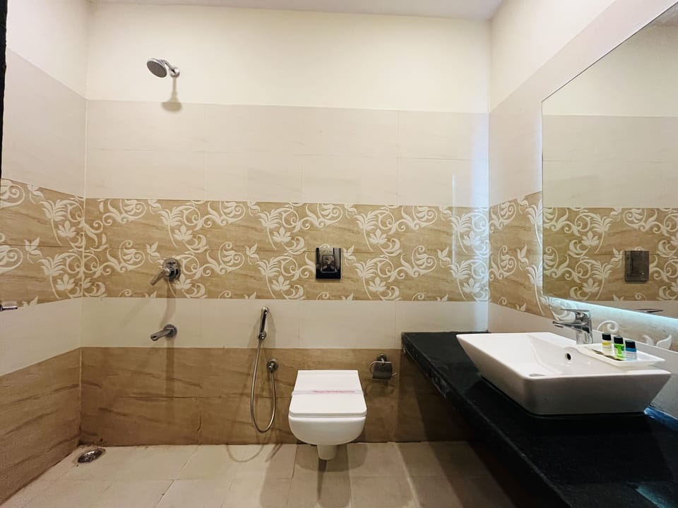 Shower, rainfall showerhead, towels, soap