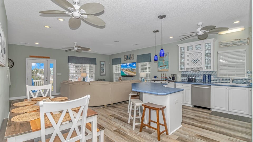 Relax in this bright open-concept space where your kitchen, dining, and living areas flow together seamlessly with coastal charm and modern comfort.
