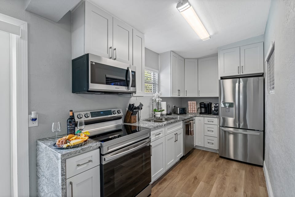 The countertops are made of high-quality materials and provide ample workspace for preparing meals.