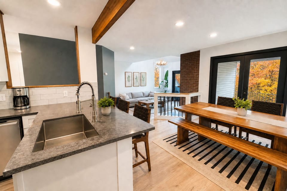 Open kitchen and dining area with fall foliage views.