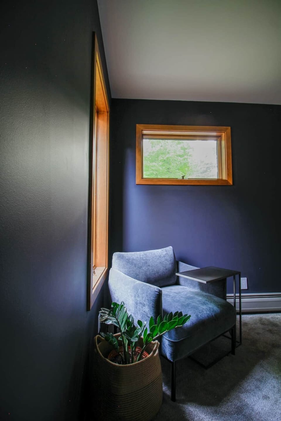 Private and quiet workspace with comfy velvet chair in secondary bedroom.