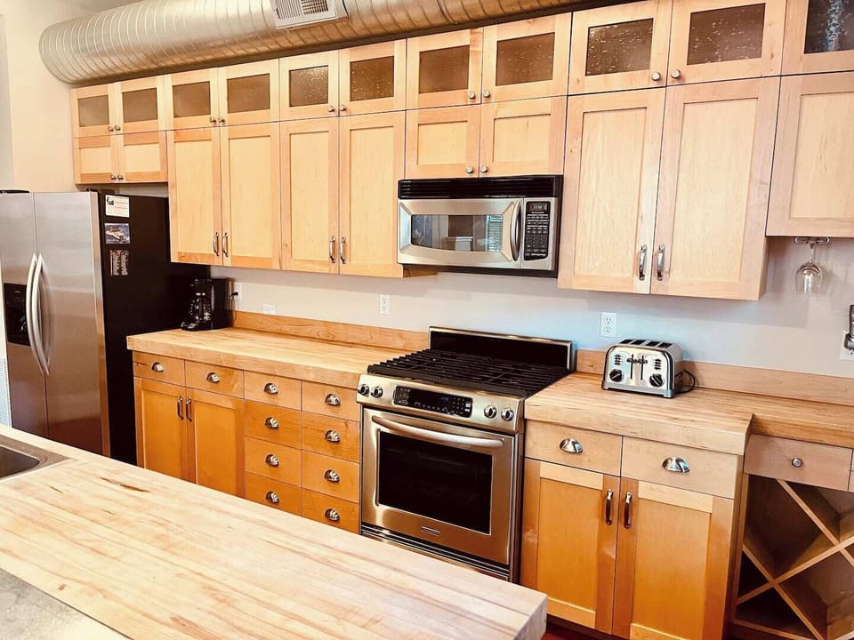 Fully stocked chef's kitchen complete with butcher block counter tops and stocked with all of the amenities of home.