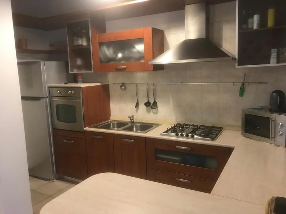 Apartment | Private kitchen | Full-size fridge, oven, stovetop, cookware/dishes/utensils