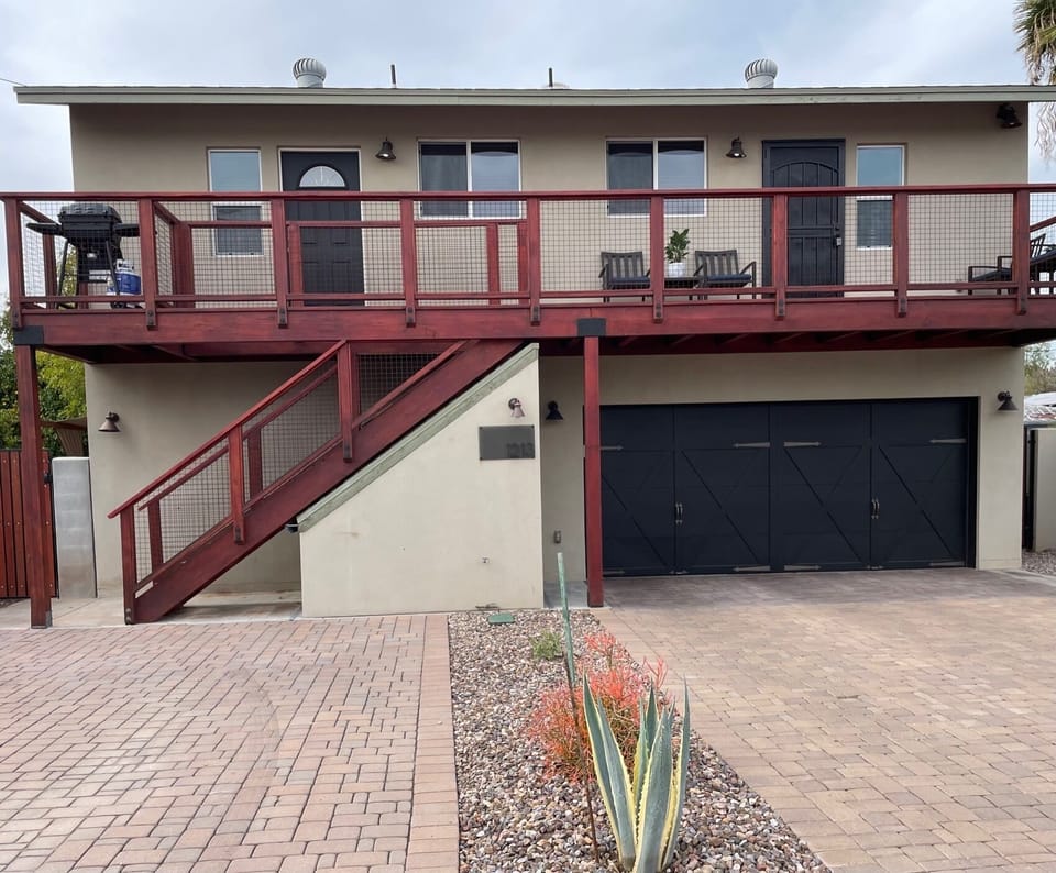The apt is on top level of this free standing garage.  Prkg on left for 2 cars