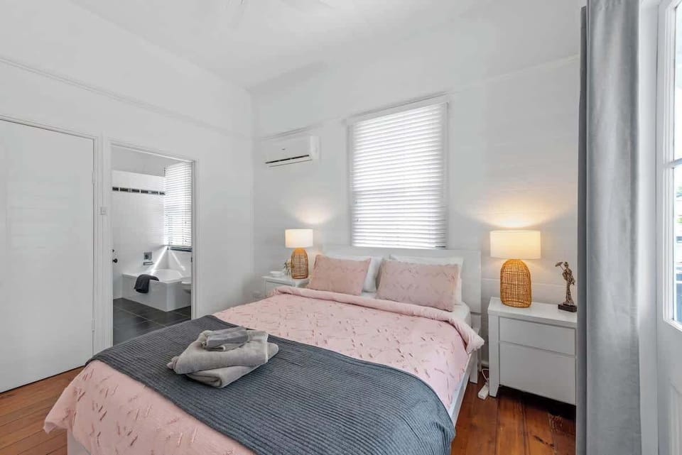 Main bedroom, opens to front deck + 2-way bathroom