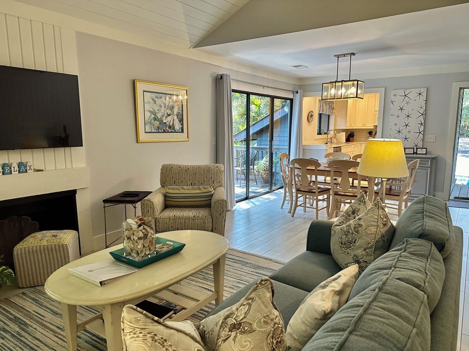Airy living room between the sunroom, kitchen and deck to porch