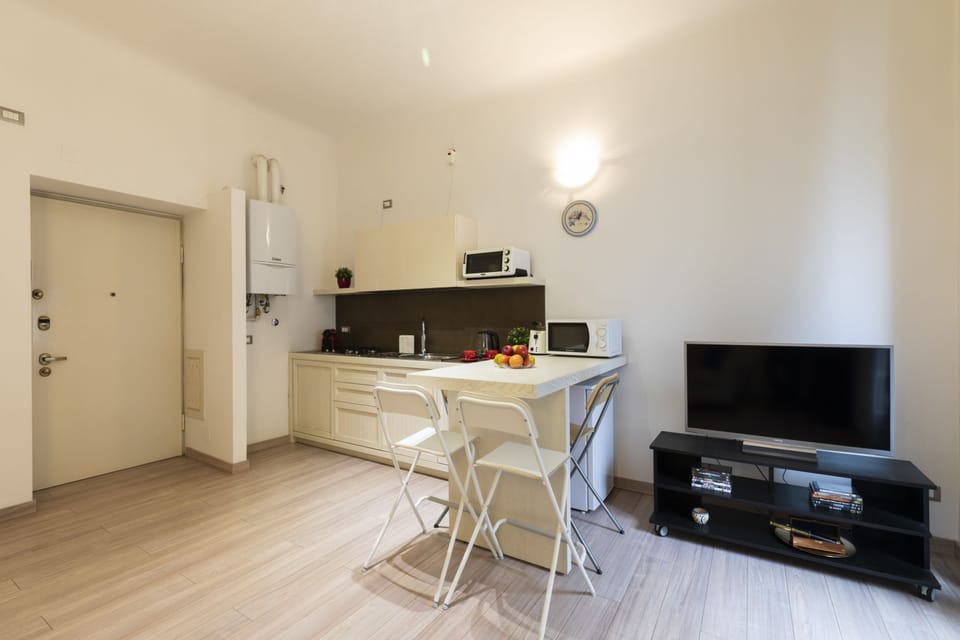 City Apartment | Living area | 32-inch flat-screen TV with digital channels, TV