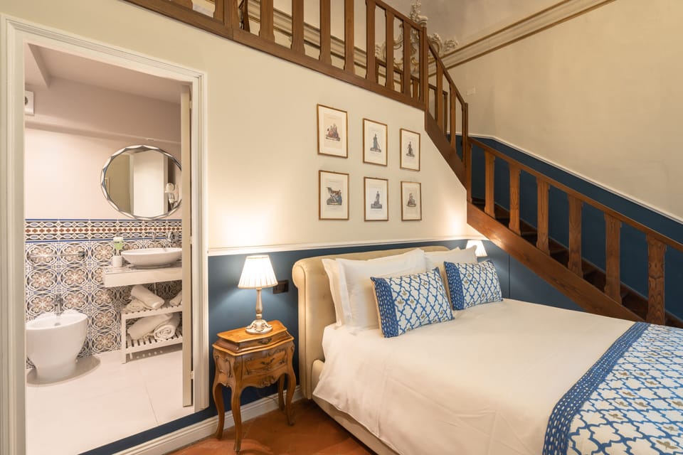 Deluxe Quadruple Room | Down comforters, pillowtop beds, in-room safe, blackout drapes