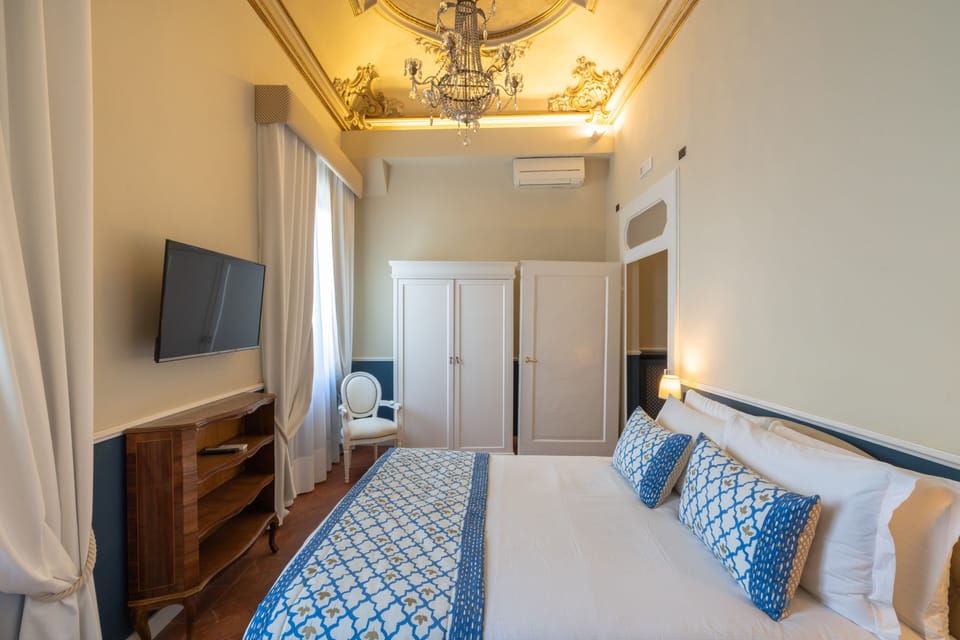 Deluxe Quadruple Room | Down comforters, pillowtop beds, in-room safe, blackout drapes