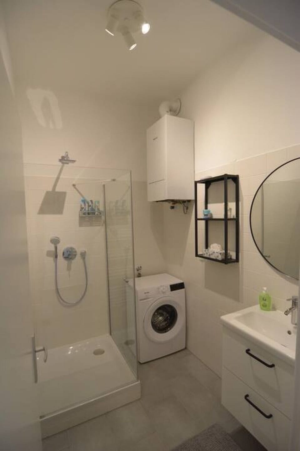 Shower room with washing machine inside, you can always use it during your stay.