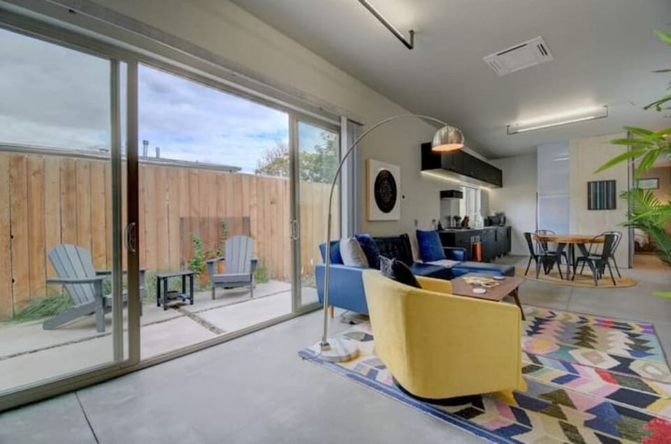 Beautiful glass doors exit to patio. Vertical blinds for light control.