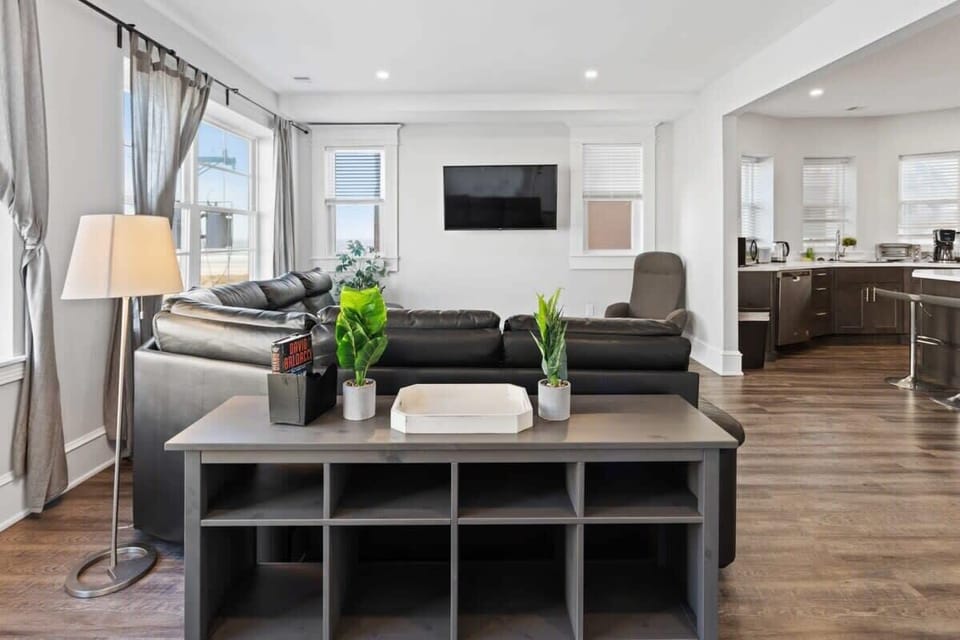 Smart TV & Large Leather Couch in Each Living Room