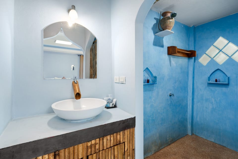 Shower, rainfall showerhead, hair dryer, towels
