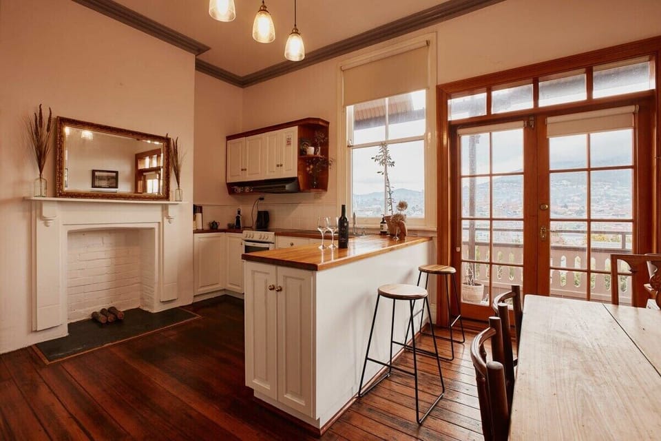 Friendly warm kitchen and dining area combines old fashion charm with modern appliances.