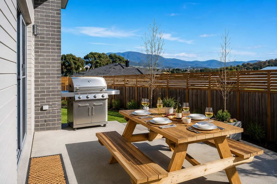 Enjoy outdoor dining with a 4-burner stainless-steel BBQ, picnic setting and peaceful mountain outlook.