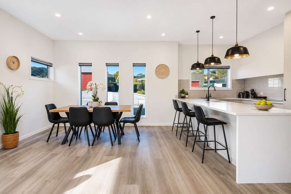 Bright open-plan living brings the lounge, dining and kitchen together — perfect for families and groups.