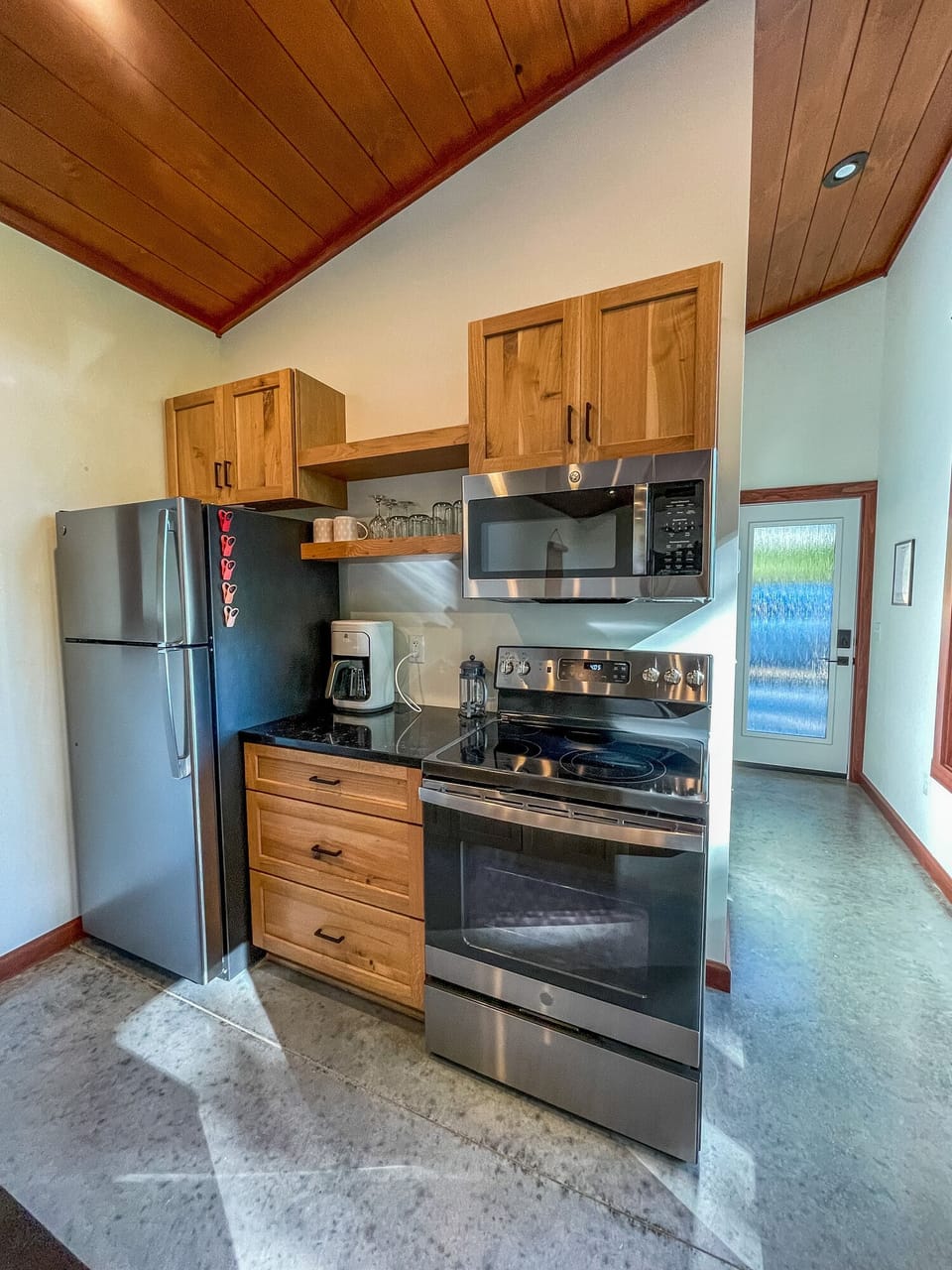 Refrigerator, range, microwave.