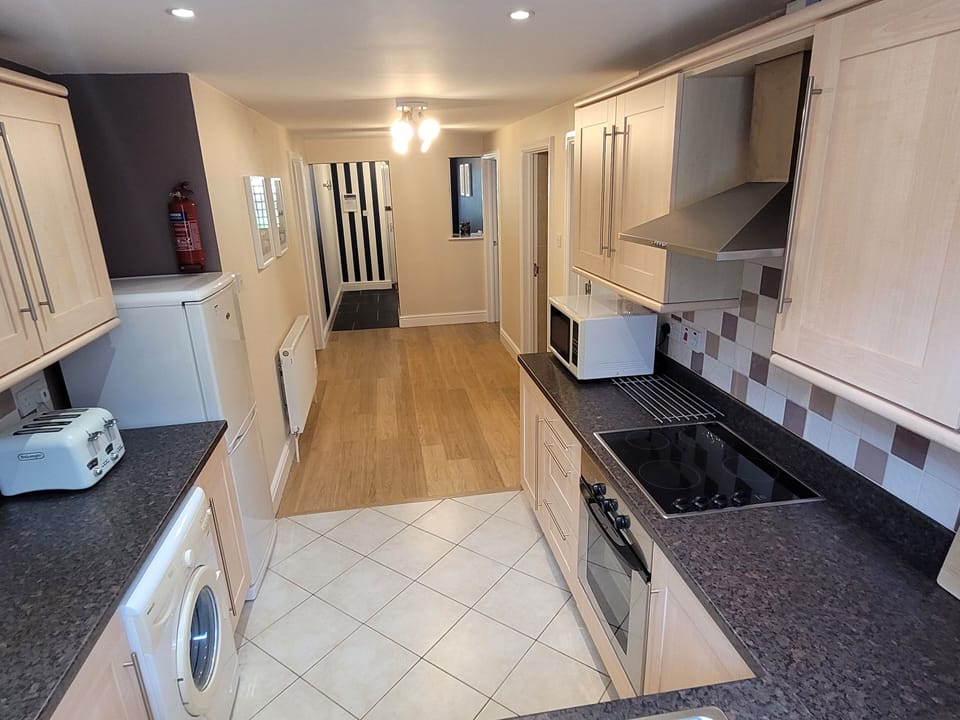 Apartment | Private kitchen | Electric kettle, dining tables