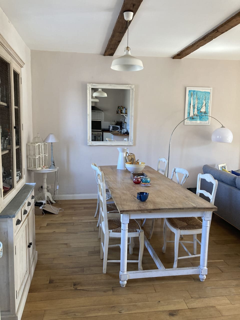 View of dining table next to kitchen area