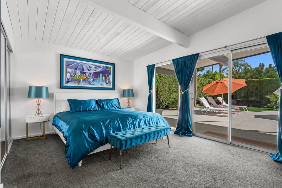 King bed, SHAG prints, en-suite, pool access — peak Palm Springs.